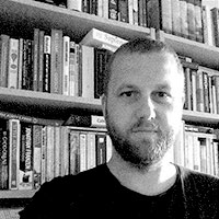 Black and white headshot of John Barton